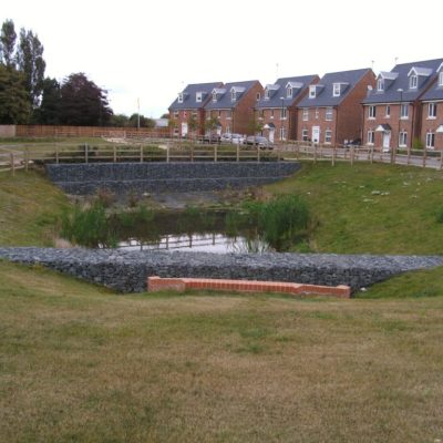 Eden_Park_SEPT_2009_SW_sewer_discharging_to_pond__overflowing_into_Stormbloc_Basin_2_via_gabion_wall-1024x768